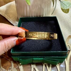 Michael Kors Gold-Tone Women's Bracelet non tarnish stainless steel.